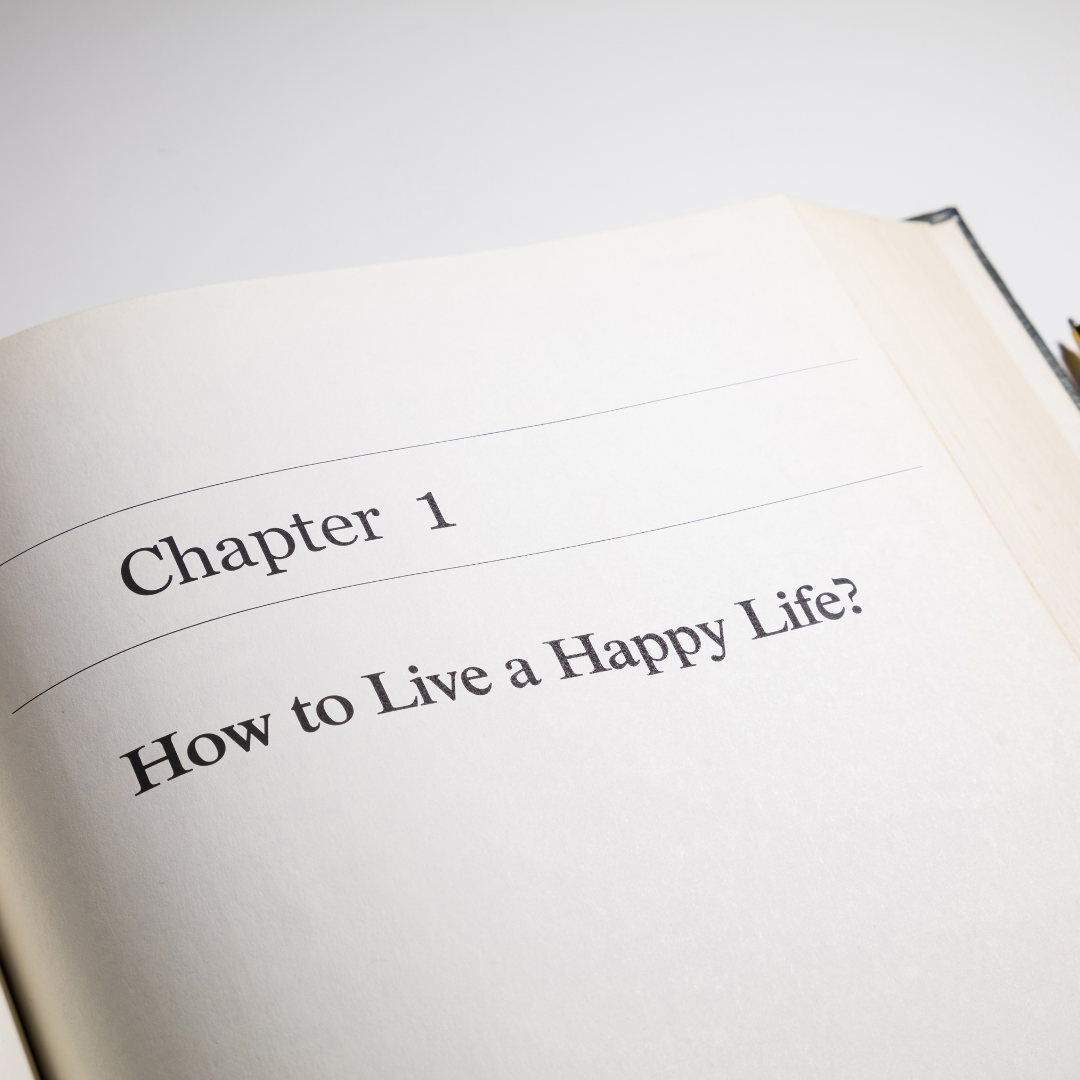 Open book page showing Chapter 1: 'How to Live a Happy Life?'